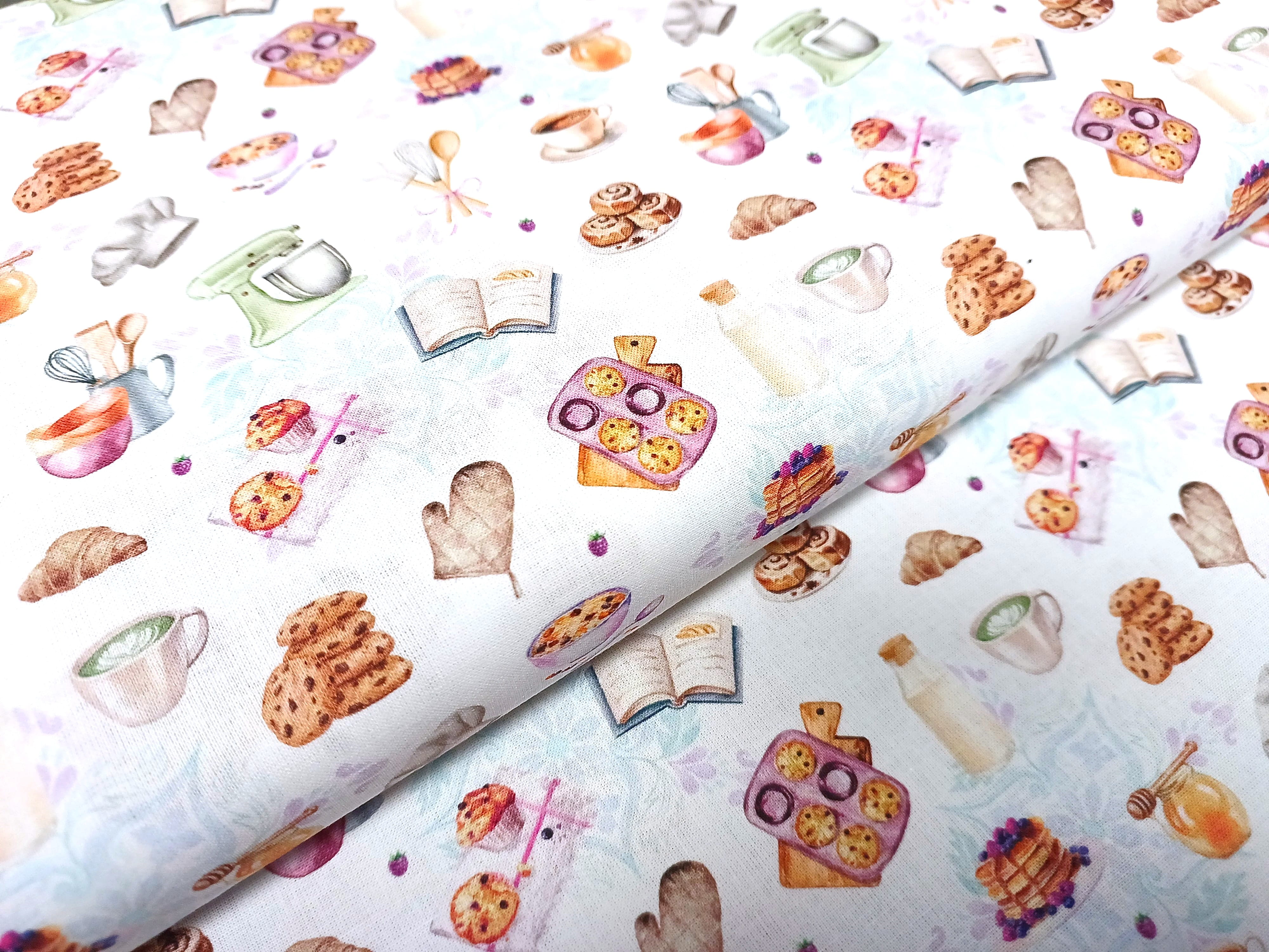 Baumwoll-Popeline mit bunten Backmotiven  wie Muffins, Cookies, Küchenutensilien und Rezptbuch auf weißem Grund