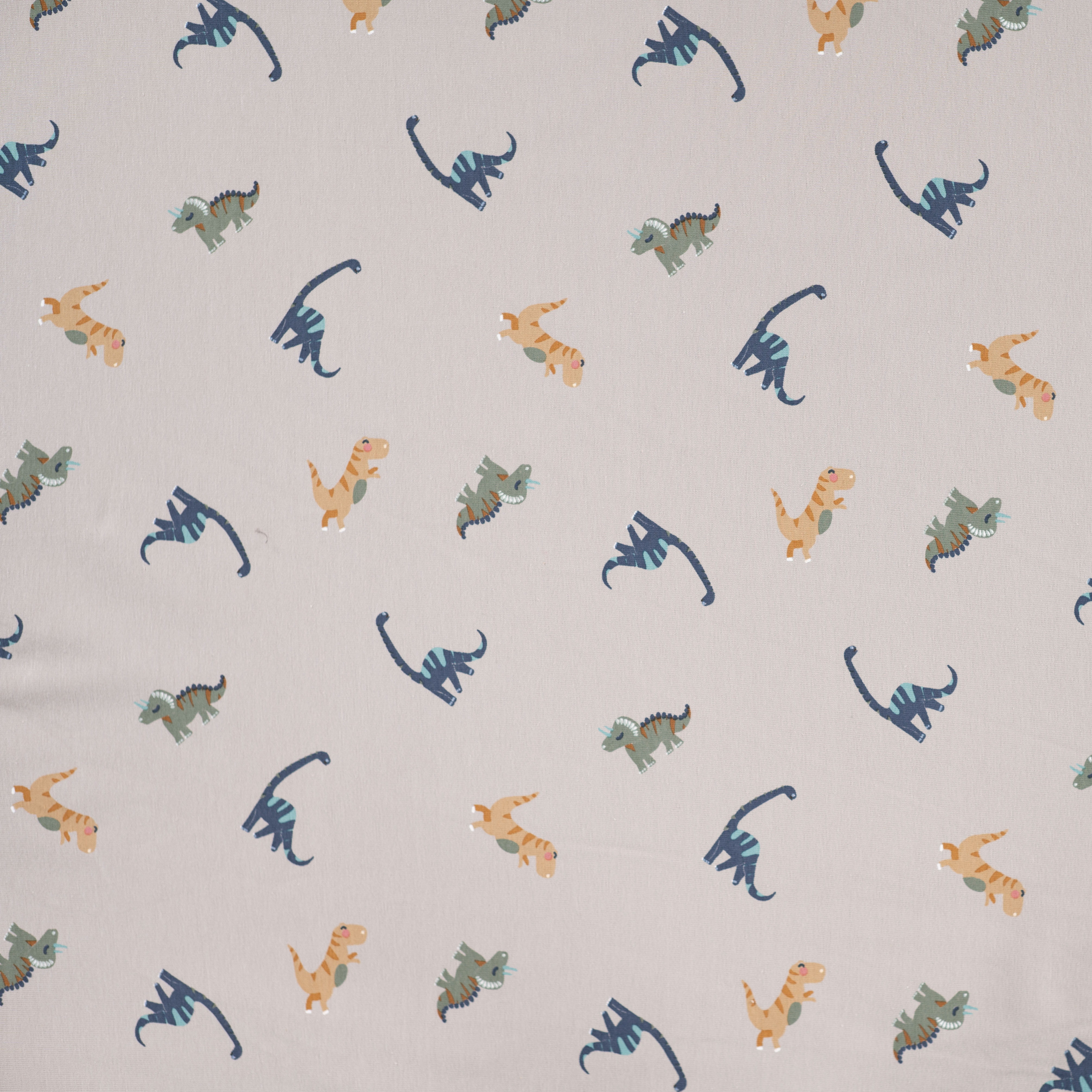  Baumwolljersey mit Dinosauriern - sand (Q520)