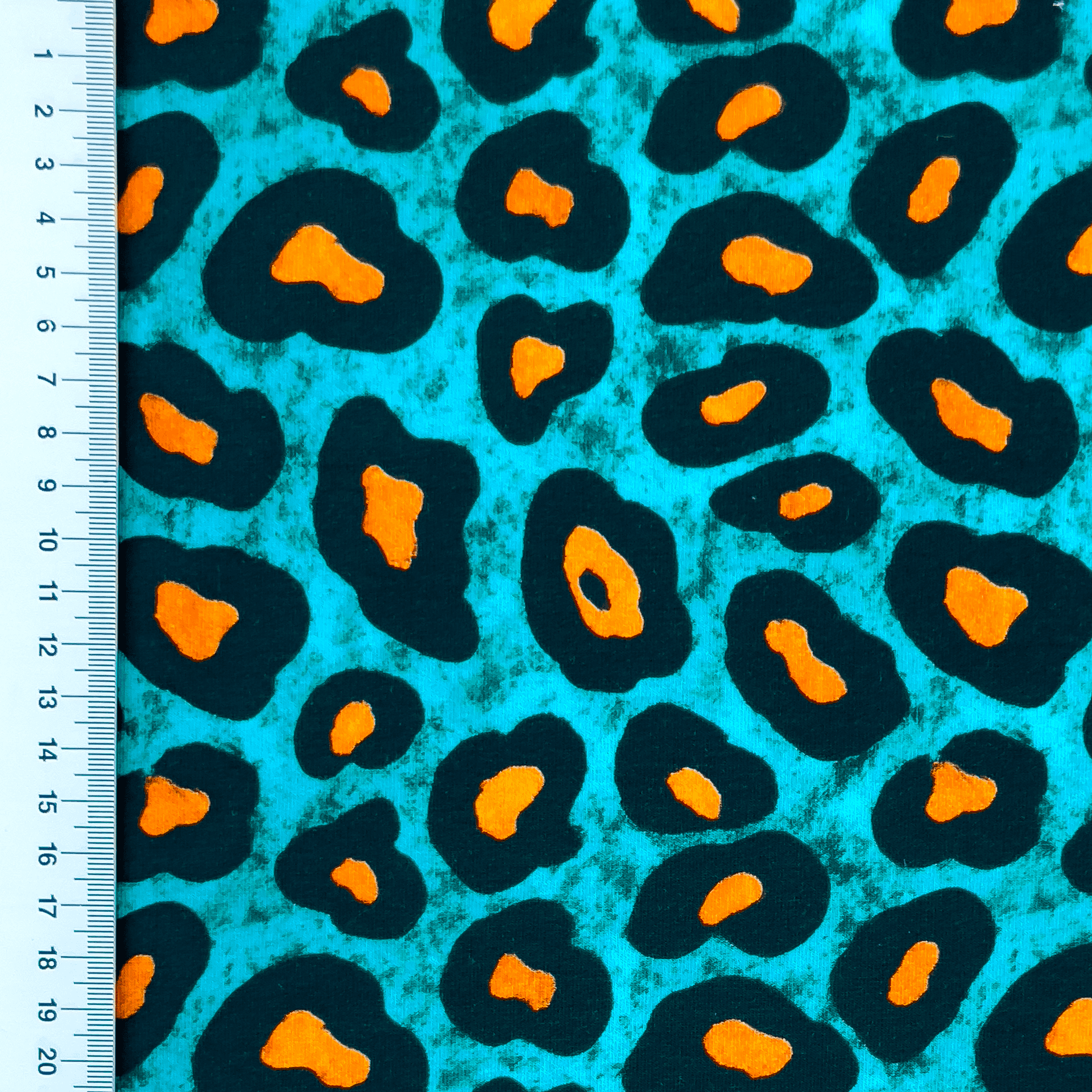 Sommersweat French Terry Digital mit orange/schwarzem Leopardenmuster - türkis