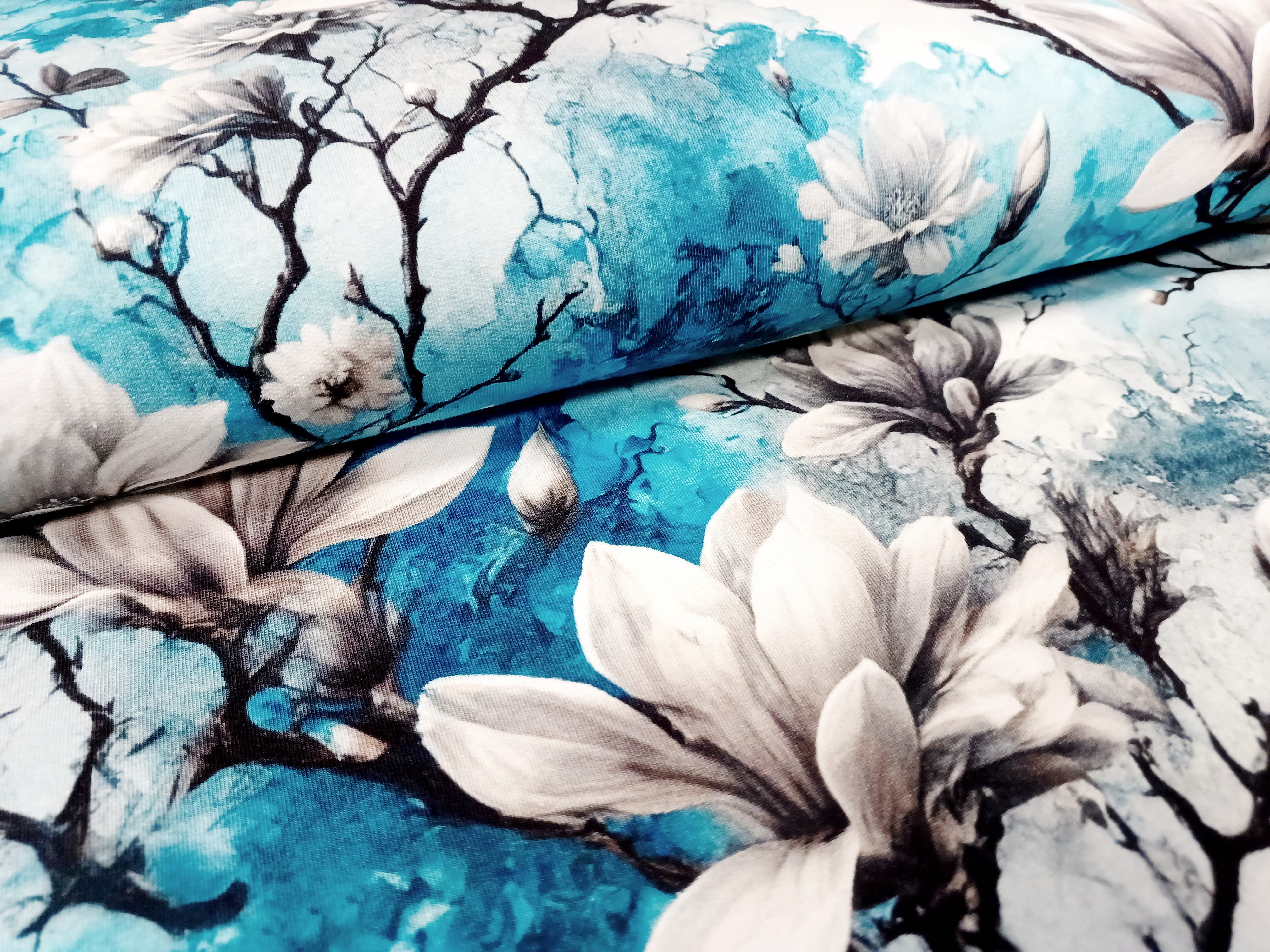 Sommersweat French Terry Digital mit weißen Magnolien - türkis